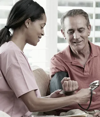 An Independent Caregiver Services home health aide with a senior client