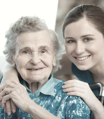 A professional caregiver providing elder care in a Northern Michigan home