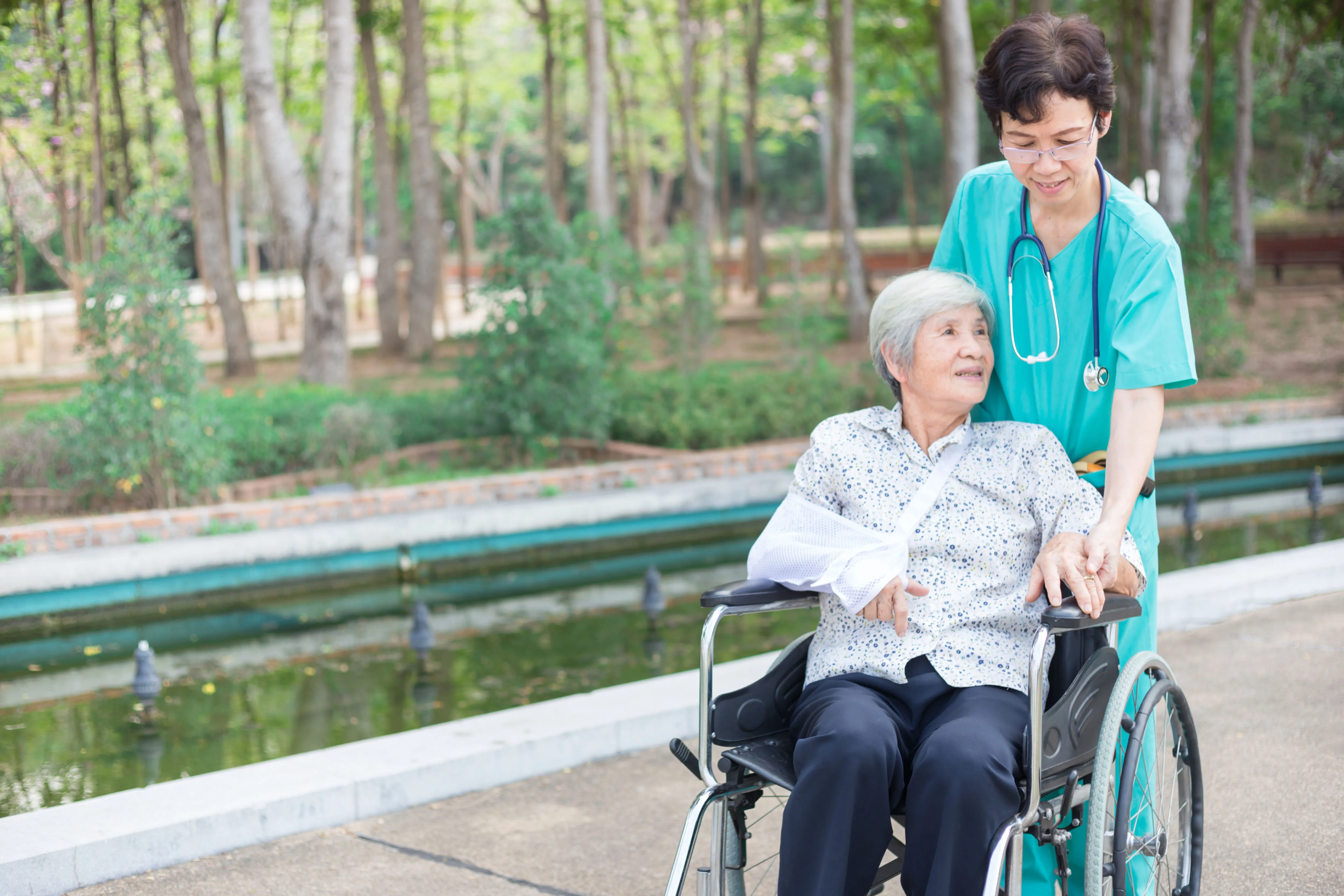 A caregiver supporting a senior recovering at home after a hospital stay