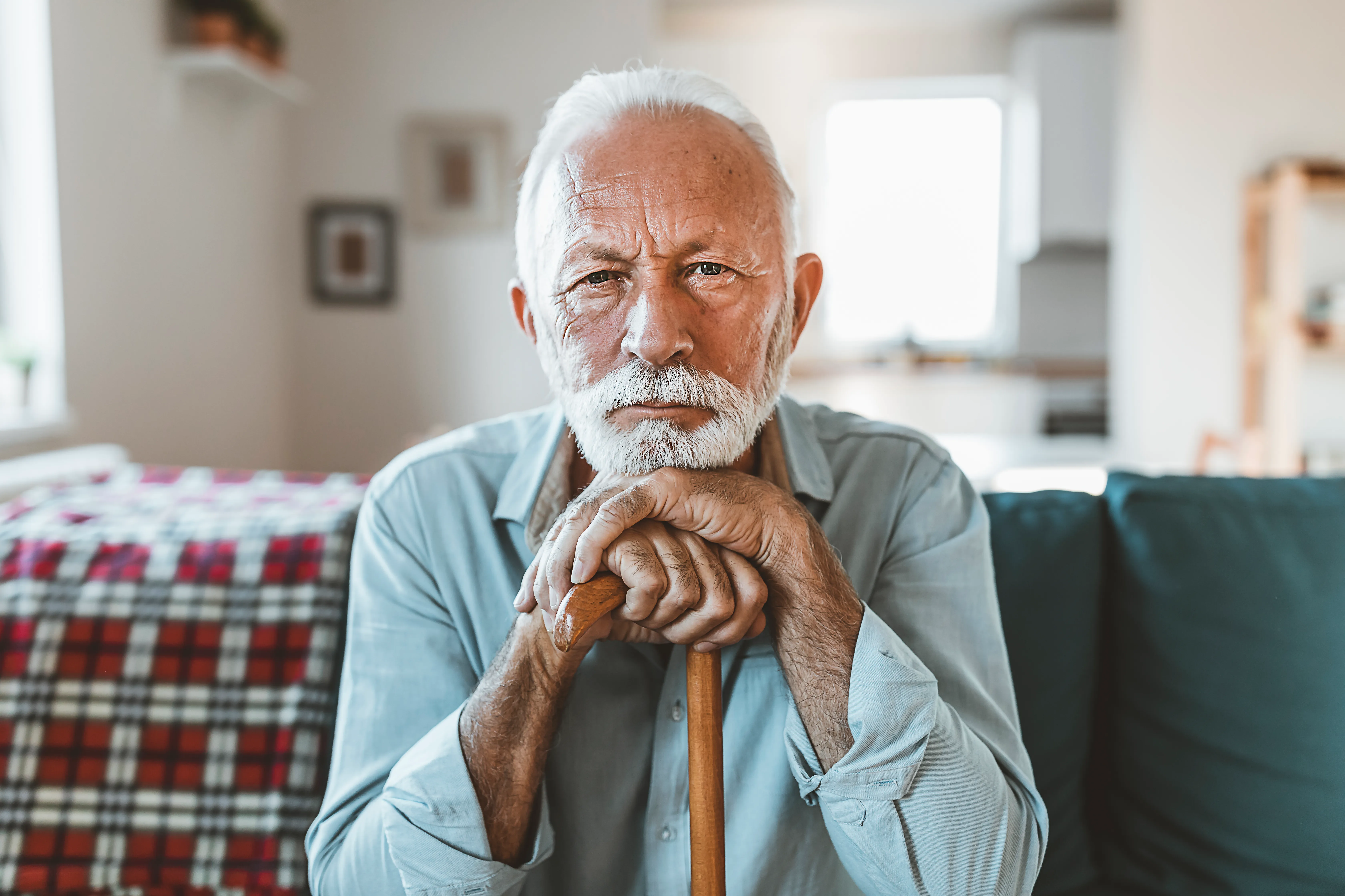 A senior man at home in Northern Michigan, thinking about care options
